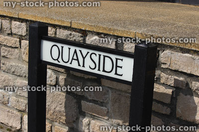 Stock image of quayside road sign / signpost leading to harbour marina