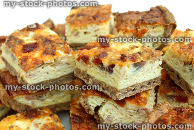 Stock image of slices of homemade bacon and egg quiche tart / savoury flan