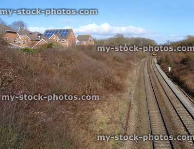 Stock image of railway line / railroad train tracks, stretching into distance
