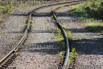 Stock image of railway line covered in gravel, countryside railroad track