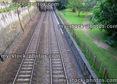Stock image of railway line tracks stretching into the distance, bridge
