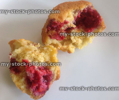 Stock image of homebaked raspberry muffin, split open to show inside