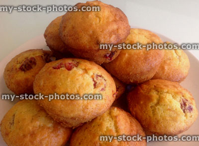 Stock image of homebaked raspberry muffins on a white plate