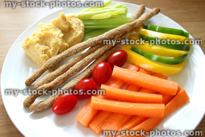Stock image of healthy lunch, raw vegetables, breadsticks, hummus, carrot sticks, celery, peppers
