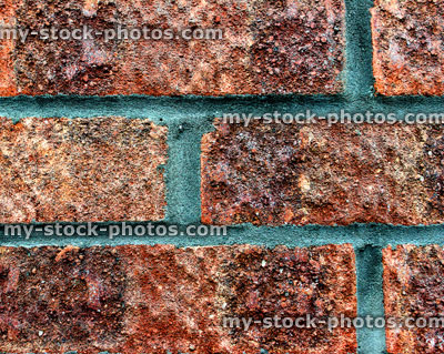 Stock image of red brick wall, showing texture (close up)