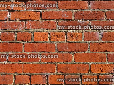 Stock image of old eroding red brick wall with crumbling mortar