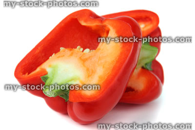 Stock image of dissected red pepper / capsicum, cross section, cut in half, seeds, stalk