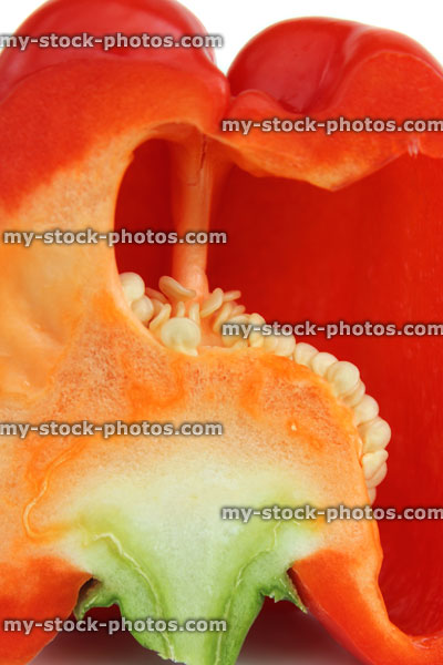 Stock image of sliced red pepper / capsicum, raw vegetable, close up seeds