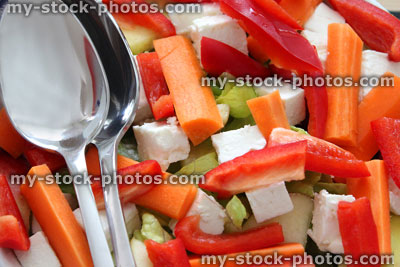 Stock image of red pepper slices, julienne carrots, Feta cheese, salad