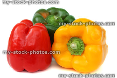Stock image of red, yellow and green traffic light bell peppers / capsicums