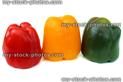 Stock image of red, yellow and green traffic light peppers in row