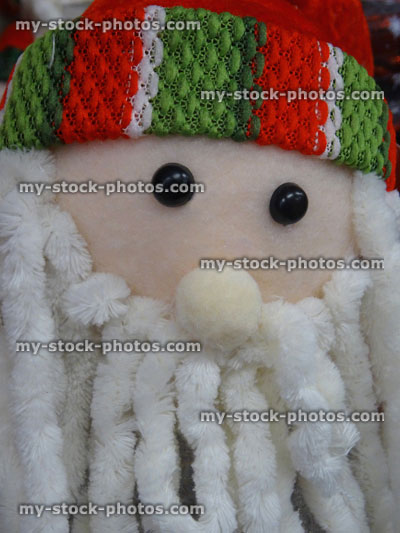 Stock image of cuddly toy cartoon Santa Claus / Father Christmas, dreadlocks white beard