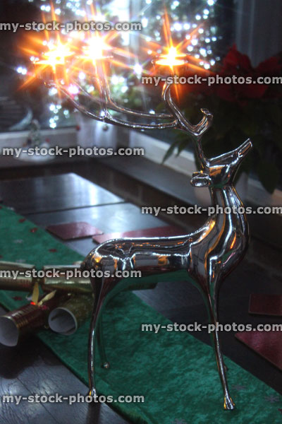 Stock image of stainless steel reindeer stag with antler candle holders / tealights