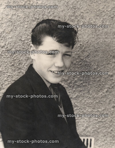 Stock image of handsome 1950s teenage boy, quiff hairstyle, black and white retro photograph