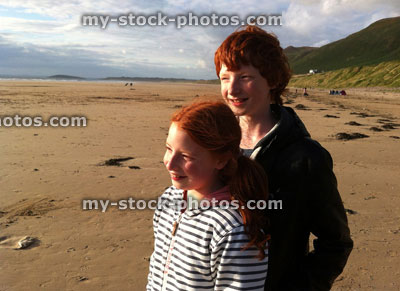 Stock image of red haired children on Rhosili Bay beach