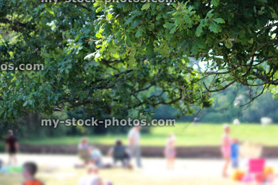 Stock image of summer scene, with children / families enjoying riverbank picnic