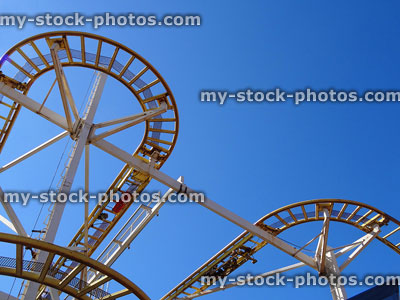 Stock image of sharp rollercoaster curves from low angle, train track bends