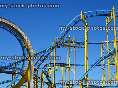 Stock image of steep slopes, loop the loop rollercoaster with metal rails / tracks