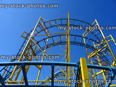 Stock image of sharp curves and bends on metal rollercoaster ride tracks