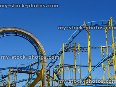 Stock image of rollercoaster loop and tracks / rails isolated against sky