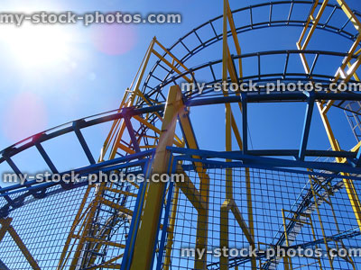 Stock image of rollercoaster curves and tracks from low angle, looking up