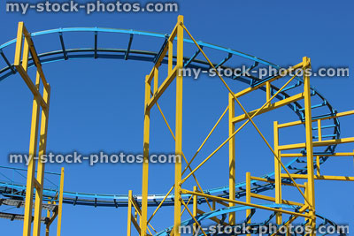Stock image of tight curves and corners of rollercoaster tracks, thrill ride