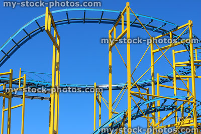 Stock image of rollercoaster ride with railroad tracks, tight corners, slopes