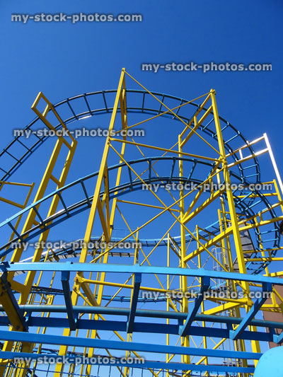 Stock image of curving rails / track of funfair rollercoaster, theme park