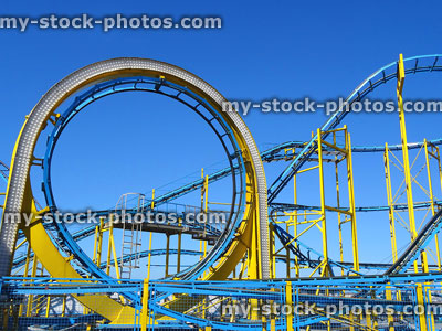 Stock image of rollercoaster ride with steep slopes, vertical loop