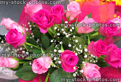 Stock image of floral bouquet comprising pink roses and gypsophila flowers