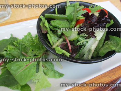 Stock image of fresh salad in dish, purple / green lettuce leaves