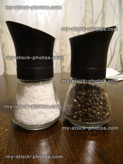 Stock image of glass salt and pepper pots / mills / shakers / grinders, cruet set