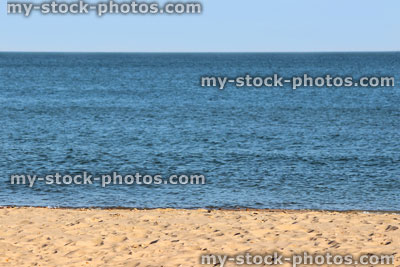 Stock image of sandy beach, sea and blue sky, seaside banner / summer holiday