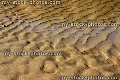 Stock image of underwater patterns in the sand, created by the sea