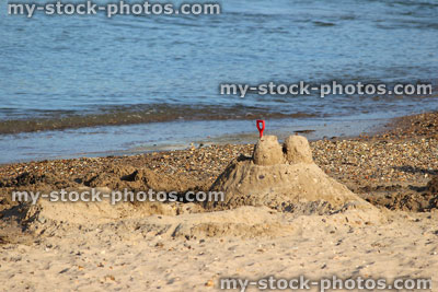 Stock image of sandcastle on beach, sand castles made on seaside holiday