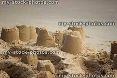 Stock image of sandcastles on beach, sand castles made on seaside holiday