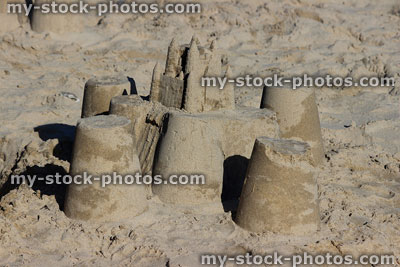 Stock image of round and square sandcastles at beach, summer holiday