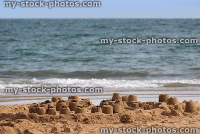 Stock image of beach seasideStock image of sandcastles on beach, sand castles made on seaside holiday