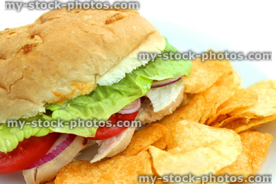 Stock image of chicken salad sandwich / sub, chicken breast, tomatoes, lettuce, red onion