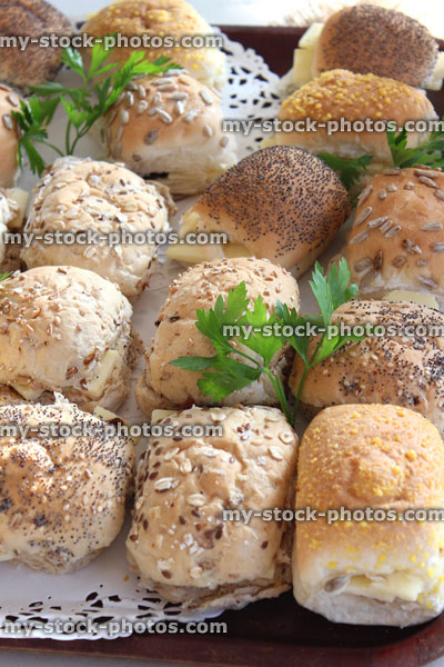 Stock image of ham, cheese and beef sandwiches / bread rolls, party food buffet