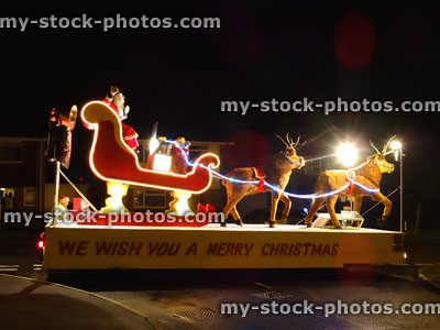 Stock image of Christmas carnival float with Santa Claus and reindeer