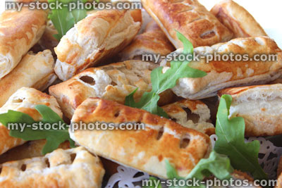 Stock image of freshly baked sausage rolls, party food, puff pastry, plate