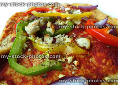 Stock image of savoury pancake topped with peppers, tomato puree, onions, Feta cheese