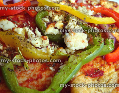 Stock image of savoury pancake topped with peppers, tomato puree, onions, Feta cheese