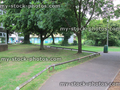Stock image of tarmac paths, trees and garden lawn at school