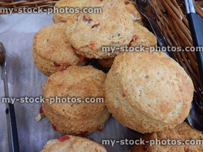 Stock image of freshly baked savoury cheese scones in wicker basket