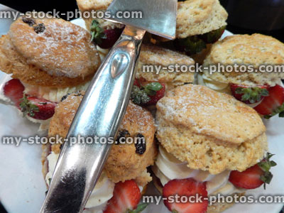 Stock image of cream scones with strawberries, cream tea cakes, afternoon tea