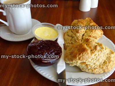 Stock image of cream tea with scones, strawberry jam, clotted cream