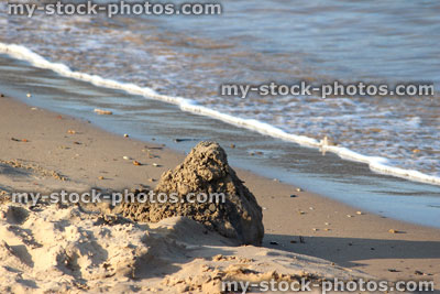 Stock image of sandcastle on beach, sandcastles made on seaside holiday