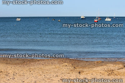Stock image of traditional English seaside, sea, sun, sandy beach, boats, yachts